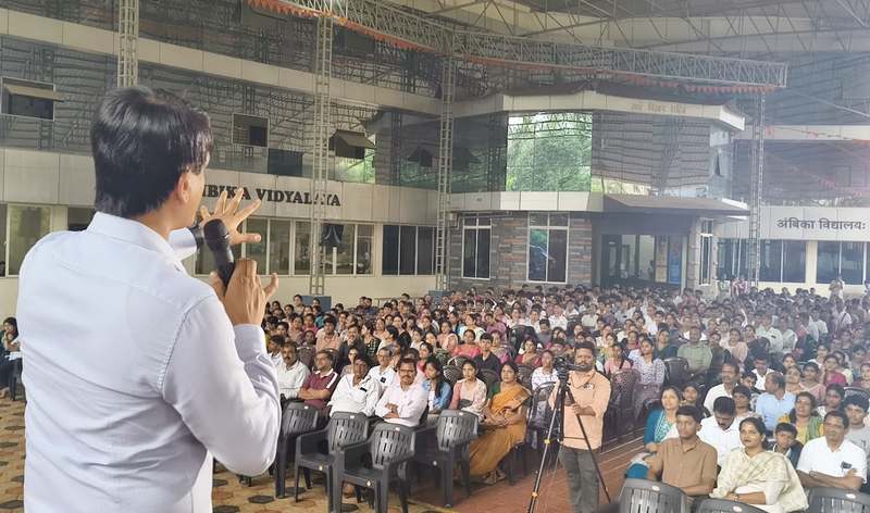 Dr. Kishan Rao addressing a large audience