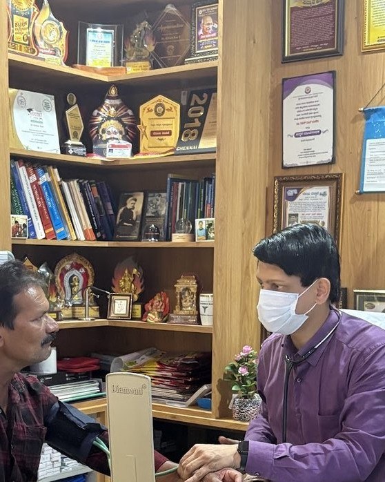 Dr. Kishan Rao consulting with a patient